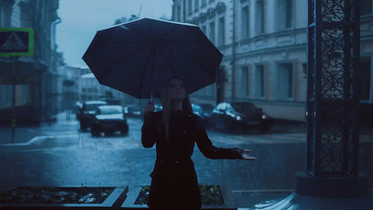 Women with an umbrella under the rain