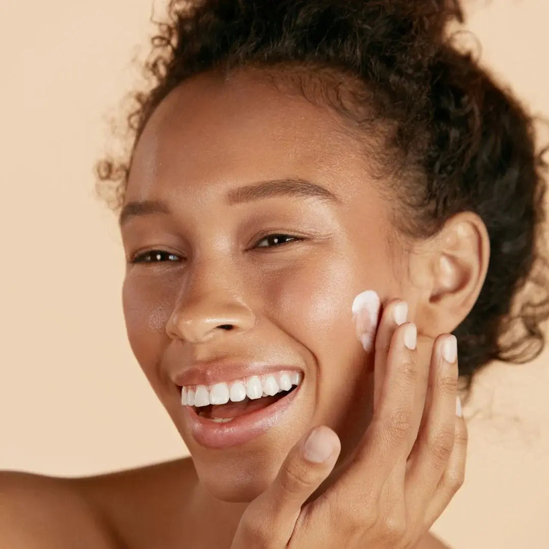 Women using cream on her face